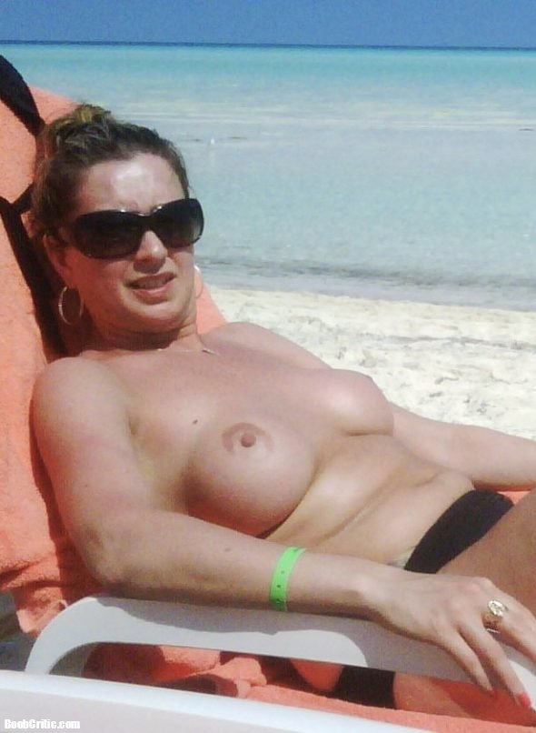 Wife topless on beach
