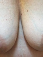 My wife showering her boobs